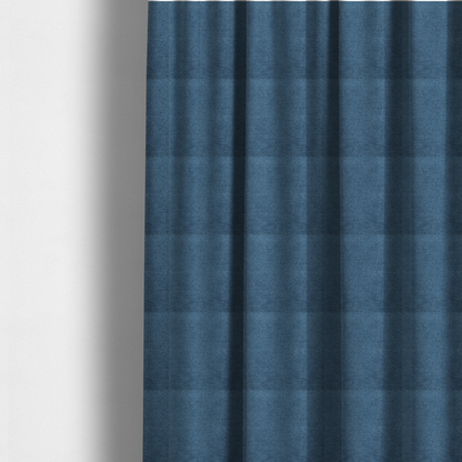 The fabric used to create these made-to-measure curtains is a rich, deep navy-blue weave with a sophisticated, textured finish. It is crafted with a dense, nubby construction that creates a subtle horizontal ribbing effect, providing both visual dimension and a substantial, premium feel.