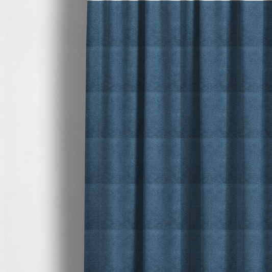 The fabric used to create these made-to-measure curtains is a rich, deep navy-blue weave with a sophisticated, textured finish. It is crafted with a dense, nubby construction that creates a subtle horizontal ribbing effect, providing both visual dimension and a substantial, premium feel.