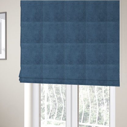 The fabric used to create these Roman blinds is a rich, deep navy-blue weave with a sophisticated, textured finish. It is crafted with a dense, nubby construction that creates a subtle horizontal ribbing effect, providing both visual dimension and a substantial, premium feel.