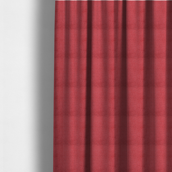 The fabric used to create these made-to-measure curtains is a bold, vibrant crimson-red fabric featuring a dense, nubby texture with a subtle horizontal ribbing effect, providing a dramatic, high-energy focal point perfect for statement upholstery or accent pieces.