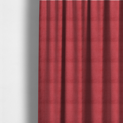 The fabric used to create these made-to-measure curtains is a bold, vibrant crimson-red fabric featuring a dense, nubby texture with a subtle horizontal ribbing effect, providing a dramatic, high-energy focal point perfect for statement upholstery or accent pieces.