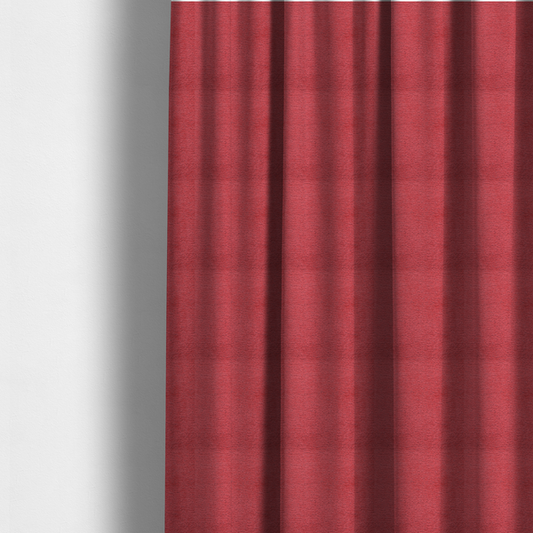 The fabric used to create these made-to-measure curtains is a bold, vibrant crimson-red fabric featuring a dense, nubby texture with a subtle horizontal ribbing effect, providing a dramatic, high-energy focal point perfect for statement upholstery or accent pieces.