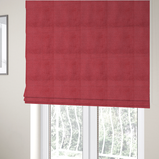 The fabric used to create these Roman blinds is  a bold, vibrant crimson-red fabric featuring a dense, nubby texture with a subtle horizontal ribbing effect, providing a dramatic, high-energy focal point perfect for statement upholstery or accent pieces.