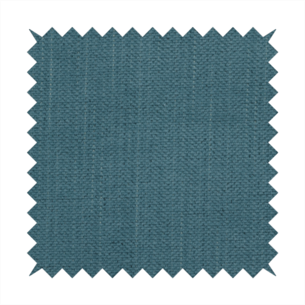 A textured woven fabric in a dusty teal or muted slate blue colour.