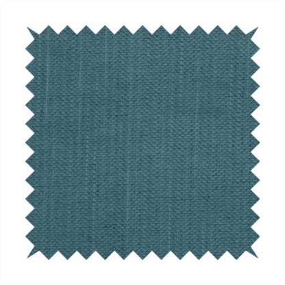 A textured woven fabric in a dusty teal or muted slate blue colour.