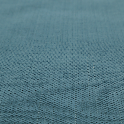 A textured woven fabric in a dusty teal or muted slate blue colour.