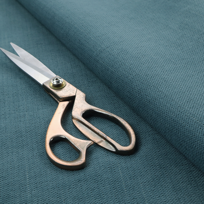 A textured woven fabric in a dusty teal or muted slate blue colour.