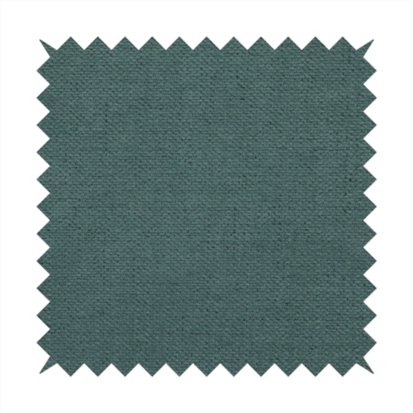 A textured woven fabric in a solid, deep sage green or muted forest green colour.
