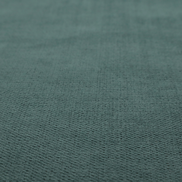 A textured woven fabric in a solid, deep sage green or muted forest green colour.