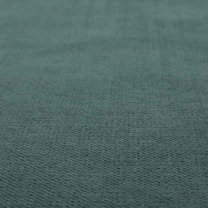 A textured woven fabric in a solid, deep sage green or muted forest green colour.
