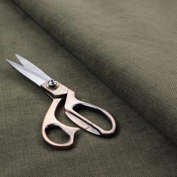 A textured woven fabric in a deep olive green or charcoal-olive hue.