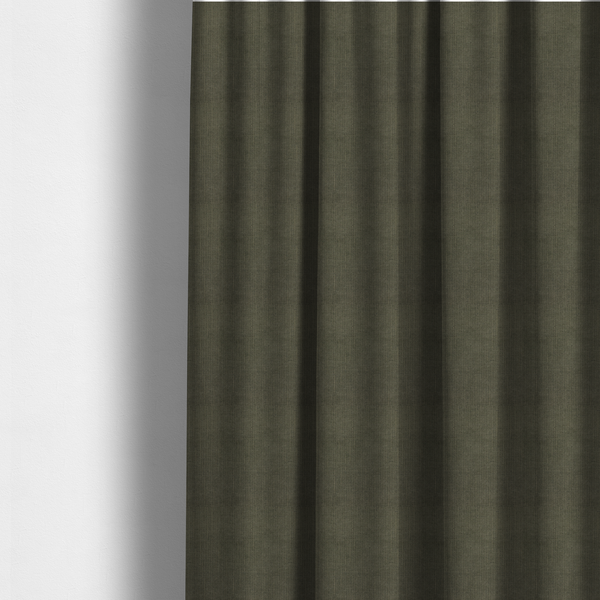 The fabric used to create these made-to-measure curtains is a textured woven fabric in a deep olive green or charcoal-olive hue.
