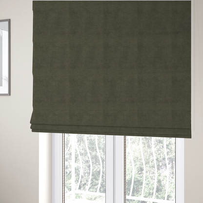 The fabric used to create these Roman blinds is a textured woven fabric in a deep olive green or charcoal-olive hue.