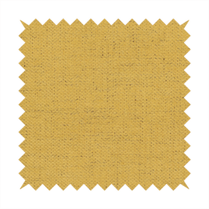 A textured woven fabric in a warm mustard yellow or golden ochre shade.