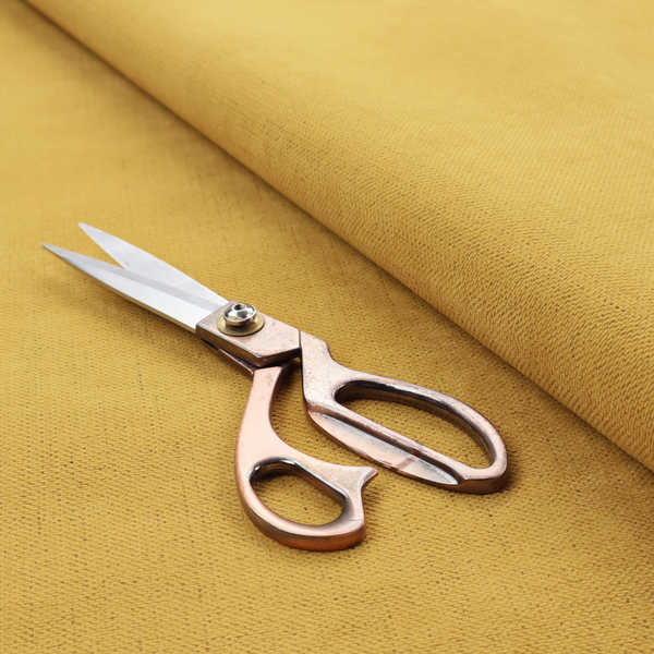 A textured woven fabric in a warm mustard yellow or golden ochre shade.