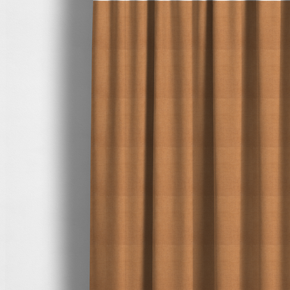 The fabric used to create these made-to-measure curtains is a textured woven fabric in a warm terracotta or soft pumpkin orange shade.