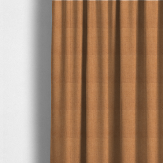 The fabric used to create these made-to-measure curtains is a textured woven fabric in a warm terracotta or soft pumpkin orange shade.