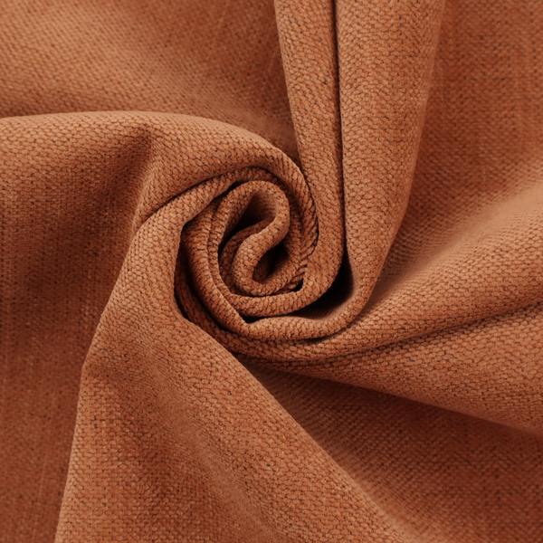 A textured woven fabric in a rich, warm rust or burnt orange shade.