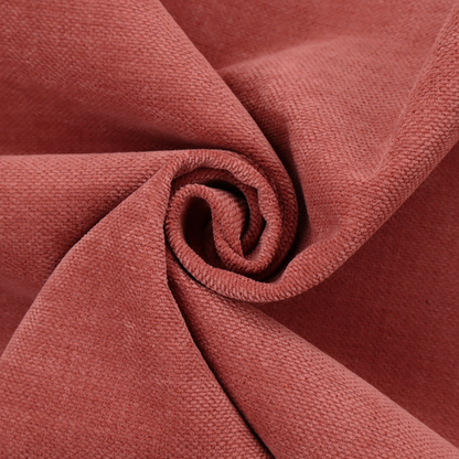 A textured woven fabric in a soft, dusty red or muted brick red shade.