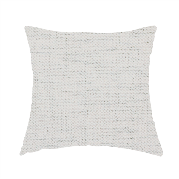 The fabric used to create this handmade cushion is a textured woven fabric in a crisp white or light ivory shade.