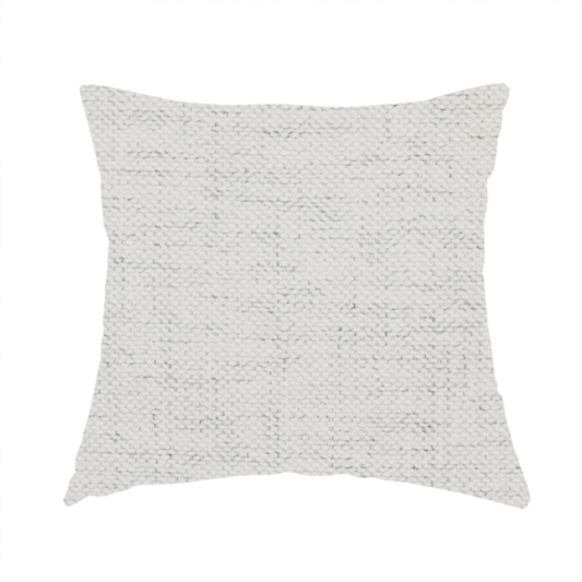 The fabric used to create this handmade cushion is a textured woven fabric in a crisp white or light ivory shade.