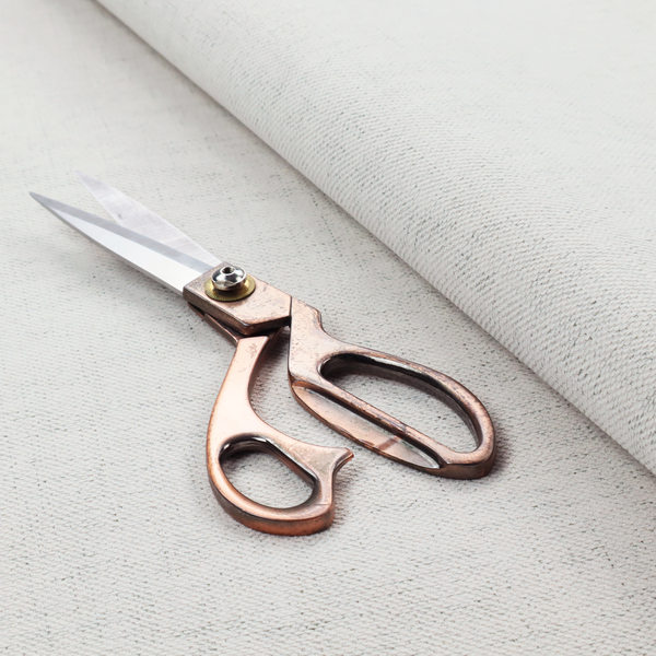 A textured woven fabric in a crisp white or light ivory shade.