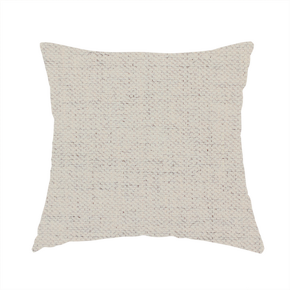 The fabric used to create this handmade cushion is a textured woven fabric in a warm off-white, light cream, or pale beige shade.