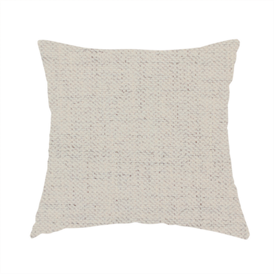 The fabric used to create this handmade cushion is a textured woven fabric in a warm off-white, light cream, or pale beige shade.