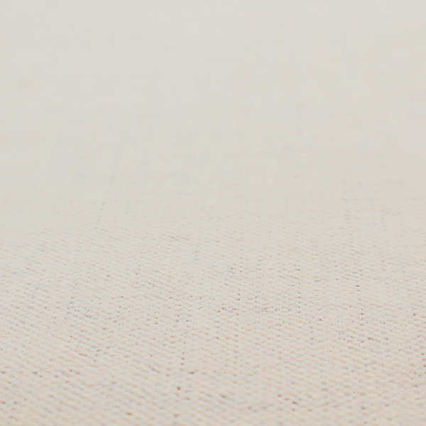 A textured woven fabric in a warm off-white, light cream, or pale beige shade.