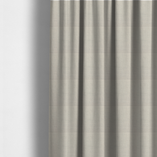The fabric used to create these made-to-measure curtains is a textured woven fabric in a warm off-white, light cream, or pale beige shade.