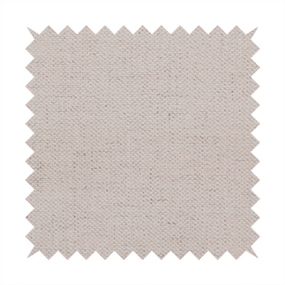 A textured woven fabric in a very pale, dusty blush pink or soft ivory shade with a subtle rosy undertone.