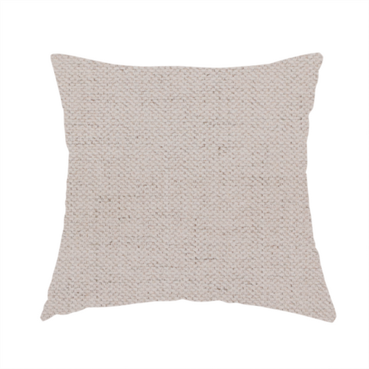 The fabric used to create these handmade cushions is a textured woven fabric in a very pale, dusty blush pink or soft ivory shade with a subtle rosy undertone.