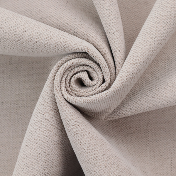 A textured woven fabric in a very pale, dusty blush pink or soft ivory shade with a subtle rosy undertone.