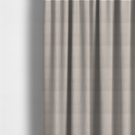 The fabric used to create these made-to-measure curtains is a textured woven fabric in a very pale, dusty blush pink or soft ivory shade with a subtle rosy undertone.