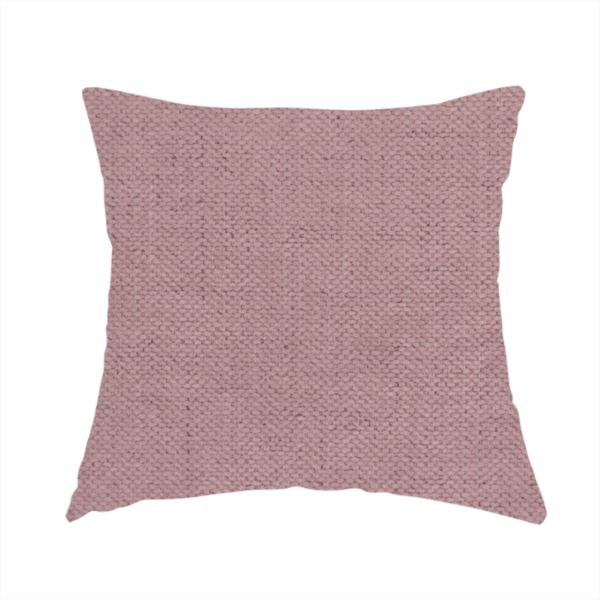 The fabric used to create this handmade cushion is a textured woven fabric in a dusty, muted rose or pale mauve shade.