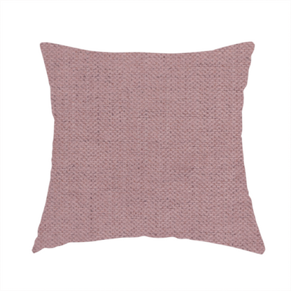 The fabric used to create this handmade cushion is a textured woven fabric in a dusty, muted rose or pale mauve shade.