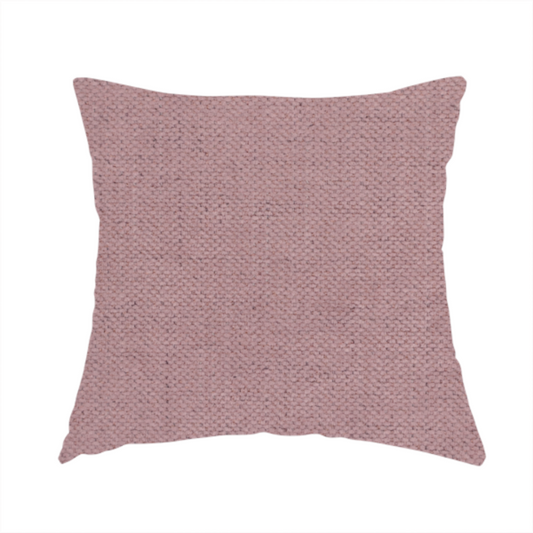 The fabric used to create this handmade cushion is a textured woven fabric in a dusty, muted rose or pale mauve shade.