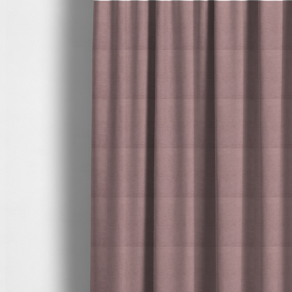 The fabric used to create these made-to-measure curtains is a textured woven fabric in a dusty, muted rose or pale mauve shade.