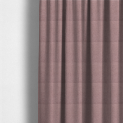 The fabric used to create these made-to-measure curtains is a textured woven fabric in a dusty, muted rose or pale mauve shade.