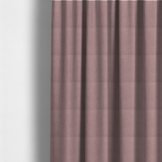 The fabric used to create these made-to-measure curtains is a textured woven fabric in a dusty, muted rose or pale mauve shade.