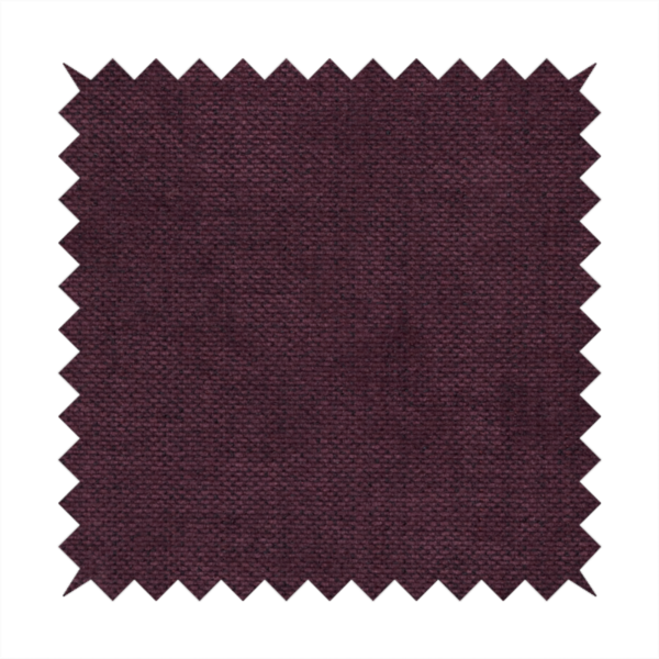 A textured woven fabric in a deep burgundy, plum, or dark aubergine shade.