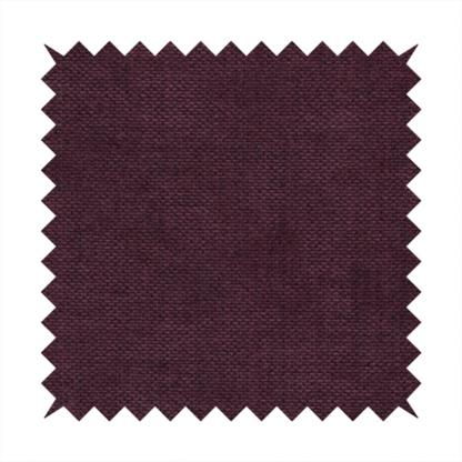 A textured woven fabric in a deep burgundy, plum, or dark aubergine shade.