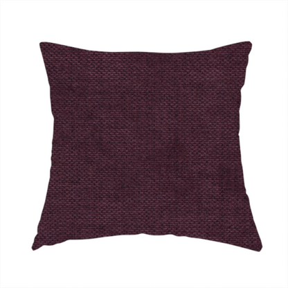 The fabric used to create these handmade cushions is a textured woven fabric in a deep burgundy, plum, or dark aubergine shade.