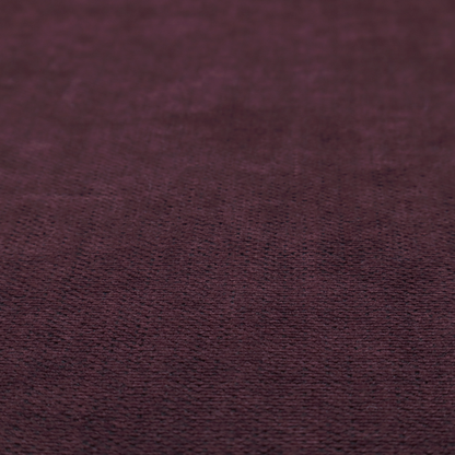A textured woven fabric in a deep burgundy, plum, or dark aubergine shade.