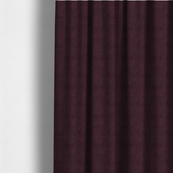 The fabric used to create these made-to-measure curtains is a textured woven fabric in a deep burgundy, plum, or dark aubergine shade.
