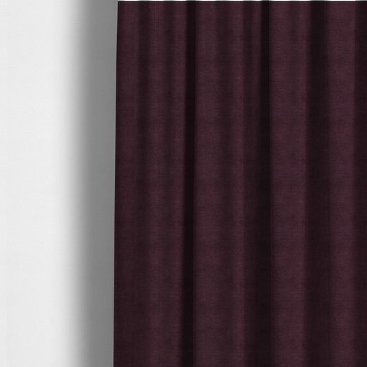 The fabric used to create these made-to-measure curtains is a textured woven fabric in a deep burgundy, plum, or dark aubergine shade.