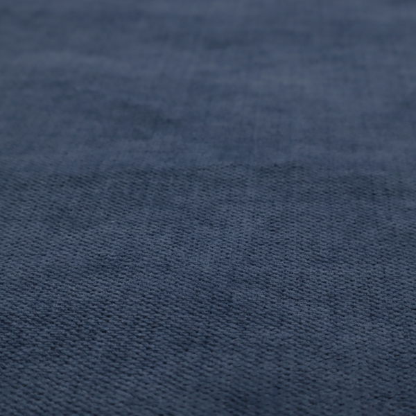A textured woven fabric in a deep denim or classic navy blue shade.