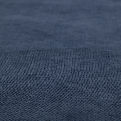 A textured woven fabric in a deep denim or classic navy blue shade.