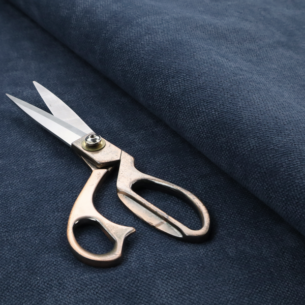 A textured woven fabric in a deep denim or classic navy blue shade.