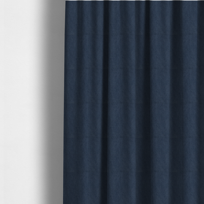 The fabric used to create these made-to-measure curtains is a textured woven fabric in a deep denim or classic navy blue shade.